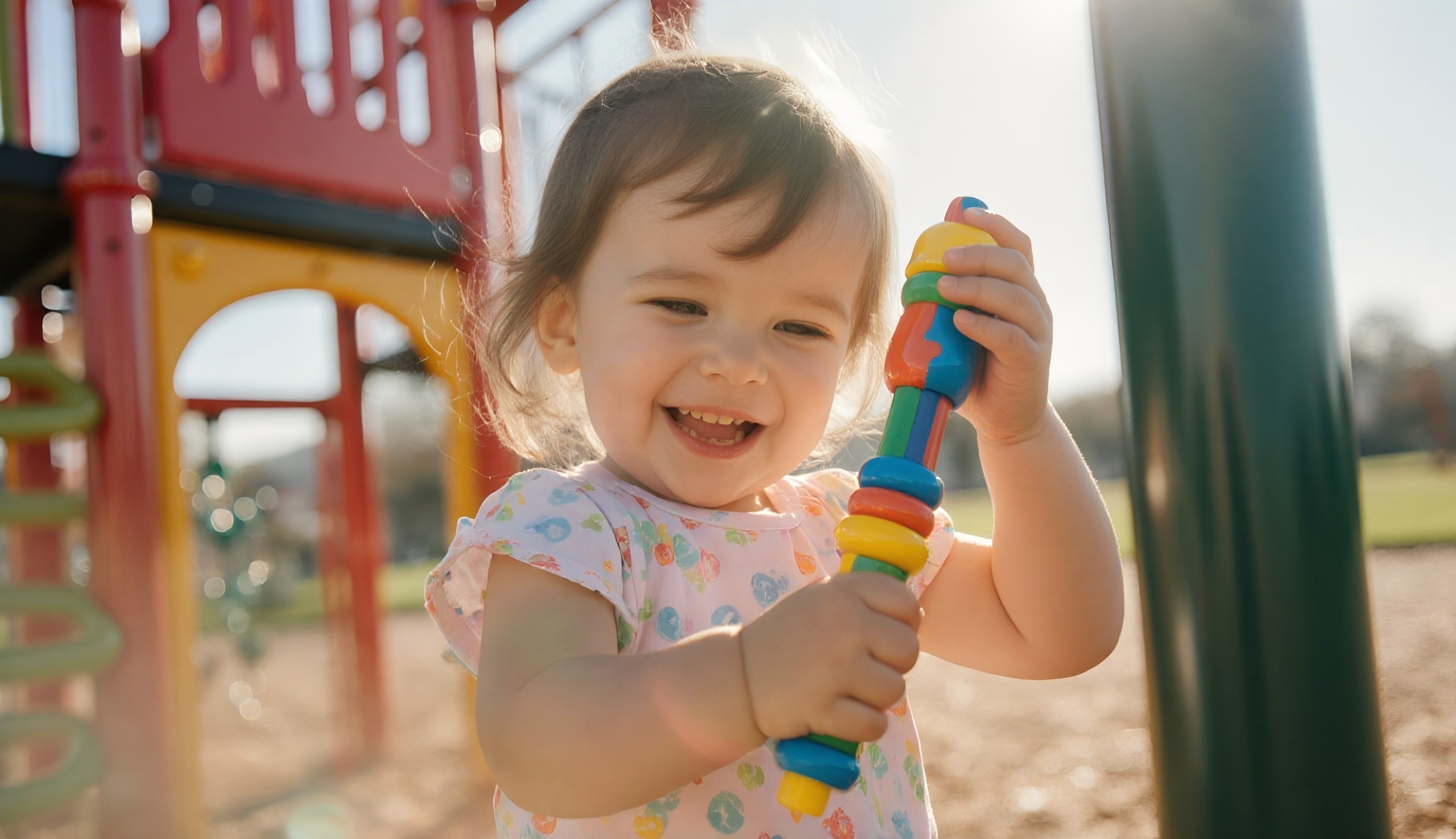 Child playing with colorful toys